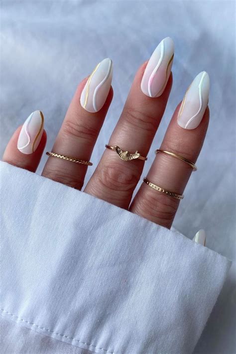 ## Summer Swipe: Elegant Almond Nails That Scream Vacation Vibes